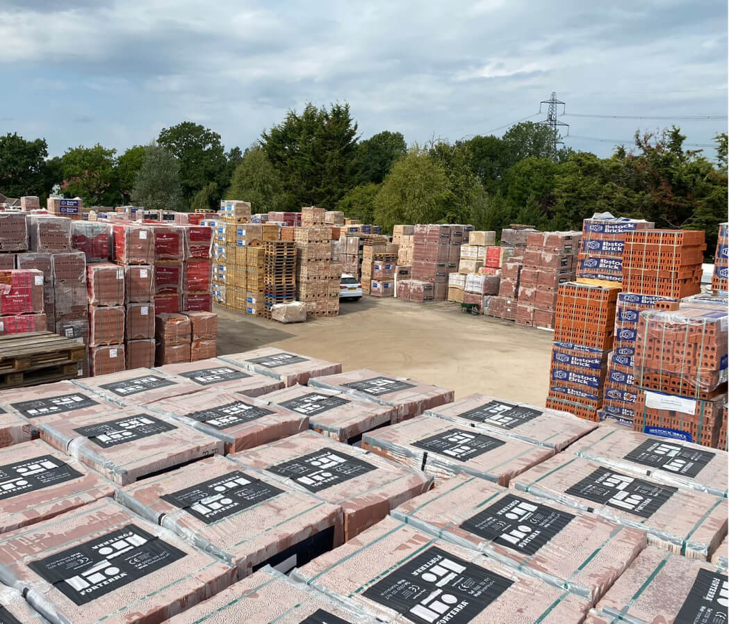 Brick yard full of brick pallets.